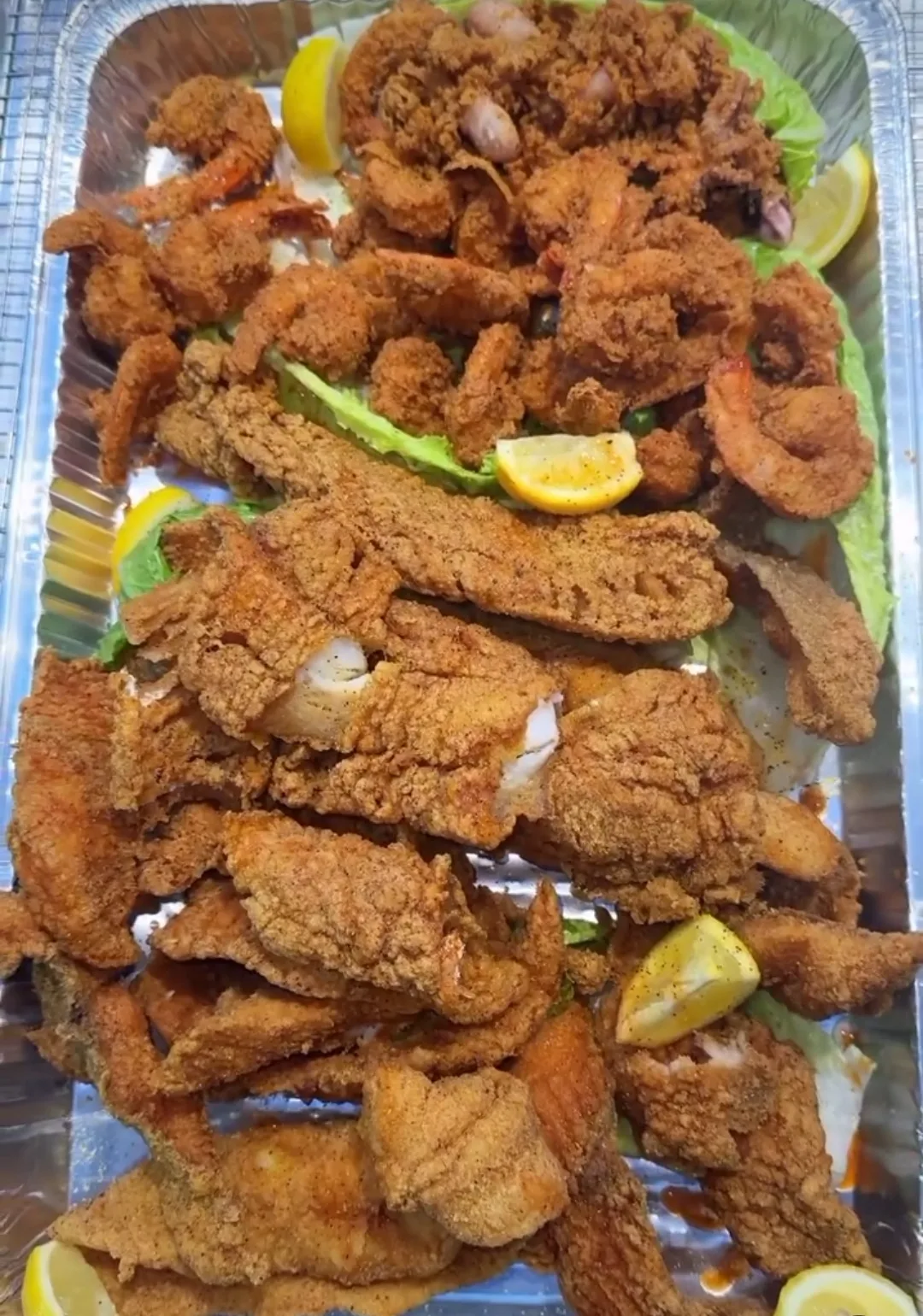 Massive fried fish and shrimp combo platter at Golden Catch Fish Market East Harlem